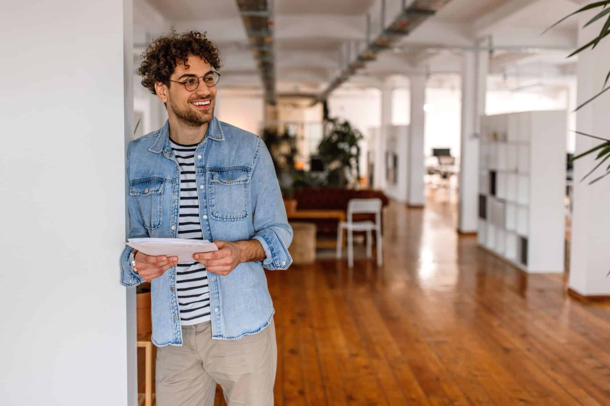 Creative professional standing in creative and production staffing office